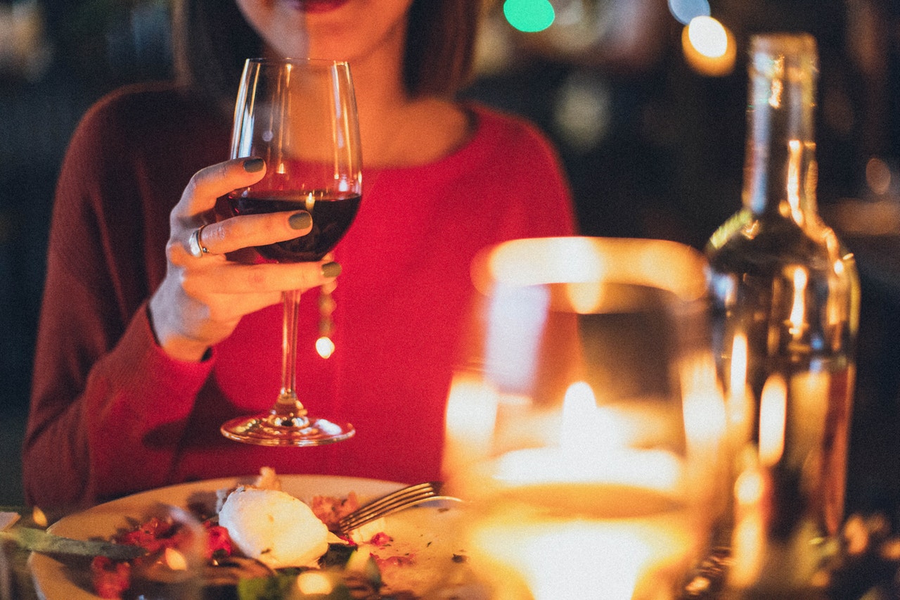 woman-holding-wine-glass-selective-focus-photography