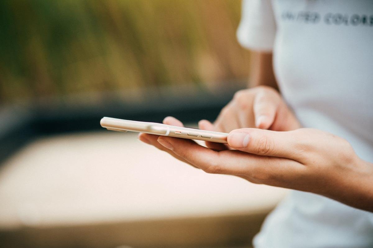 Person-Standing-While-Using-Phone-1